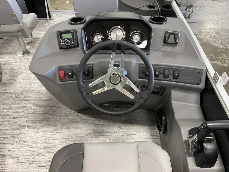 Slide: The Image of 2025 Bennington 188 SF Family boat dashboard with steering wheel and control panel. - 27
