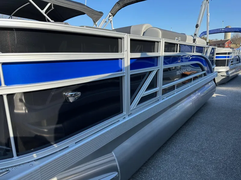 Slide: The Image of 2025 Bennington 188 SF pontoon boat with blue and silver detailing, in stock. - 31