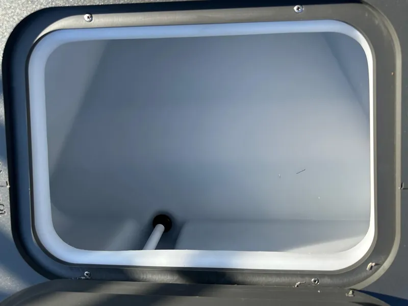 Slide: The Image of Storage compartment of 2025 Bennington 188 SF Family boat, open and empty. - 34