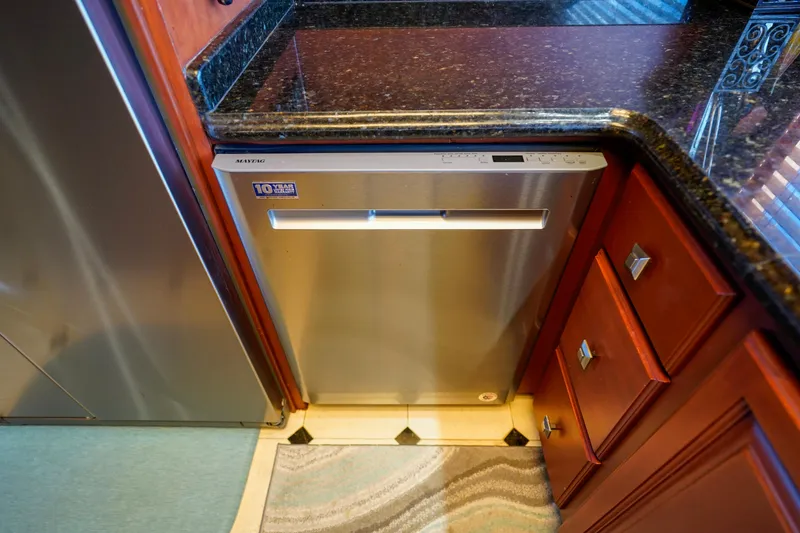 Slide: The Image of Stainless steel dishwasher in the kitchen of a 1997 Hatteras Sportfish yacht. - 18