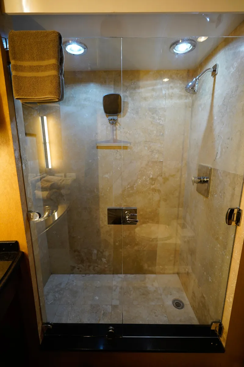 Slide: The Image of Luxurious shower in 1997 Hatteras Sportfish yacht with glass door and modern fixtures. - 28