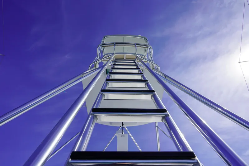 Slide: The Image of Ladder to the tower of a 1997 Hatteras Sportfish boat against a clear blue sky. - 6