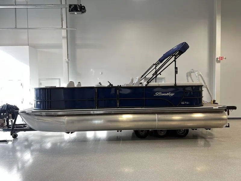 Slide: The Image of 2024 Bentley Pontoons Legacy 220 Navigator in showroom. - 4