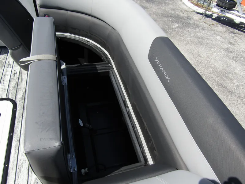 Slide: The Image of 2024 Veranda RELAX VR25RFL boat seating with storage compartment, featuring sleek gray upholstery. - 11