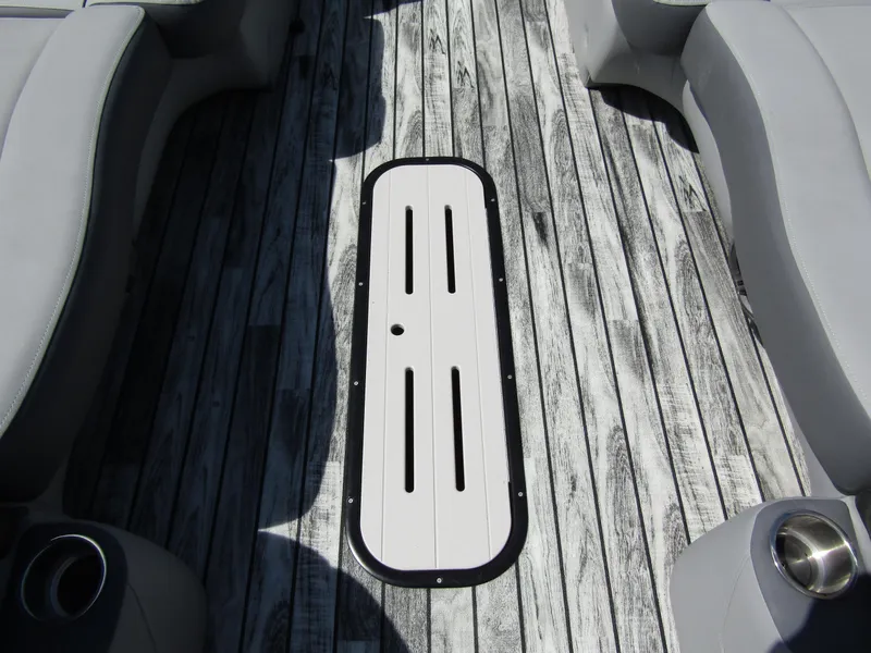 Slide: The Image of 2024 Veranda RELAX VR25RFL boat interior with stylish wood-patterned flooring and comfortable seating. - 12