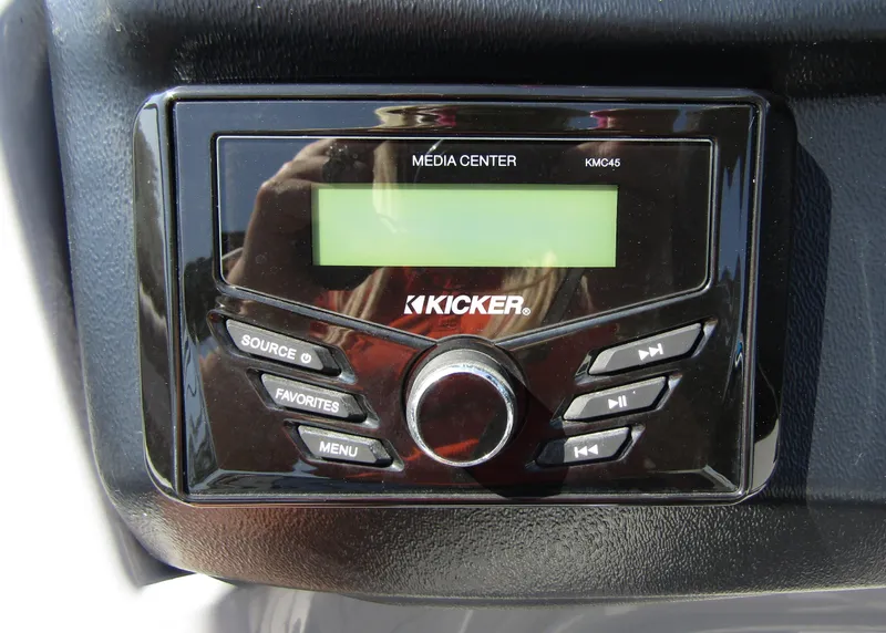 Slide: The Image of Kicker media center in 2024 Veranda RELAX VR25RFL boat, featuring control buttons and display. - 19