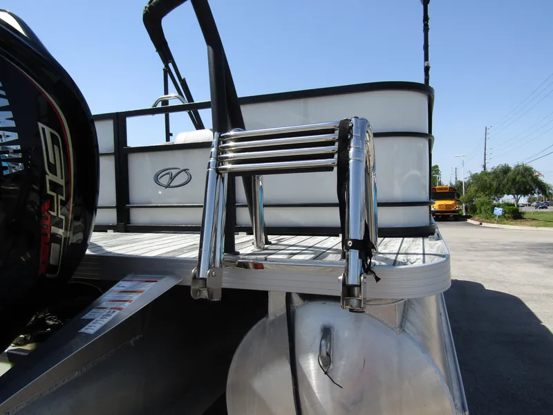Slide: The Image of 2024 Veranda RELAX VR25RFL pontoon boat with chrome ladder and Yamaha outboard motor. - 2