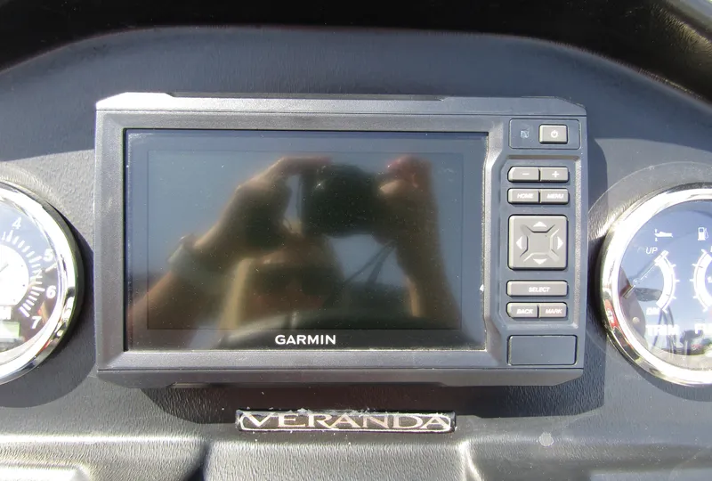 Slide: The Image of Garmin display on 2024 Veranda RELAX VR25RFL dashboard with gauges. - 21