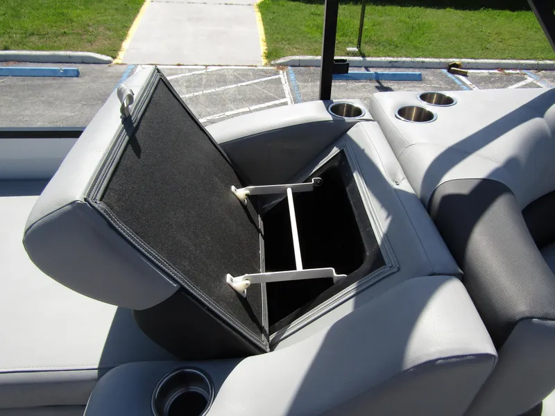 Slide: The Image of 2024 Veranda RELAX VR25RFL boat seat with open storage compartment and cup holders. - 28