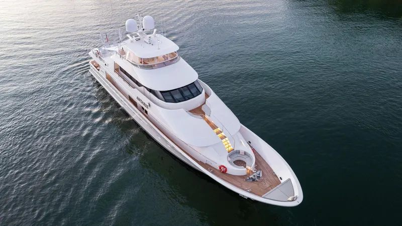 Slide: The Image of Aerial view of a 2008 Westport 130 luxury yacht on calm waters. - 15