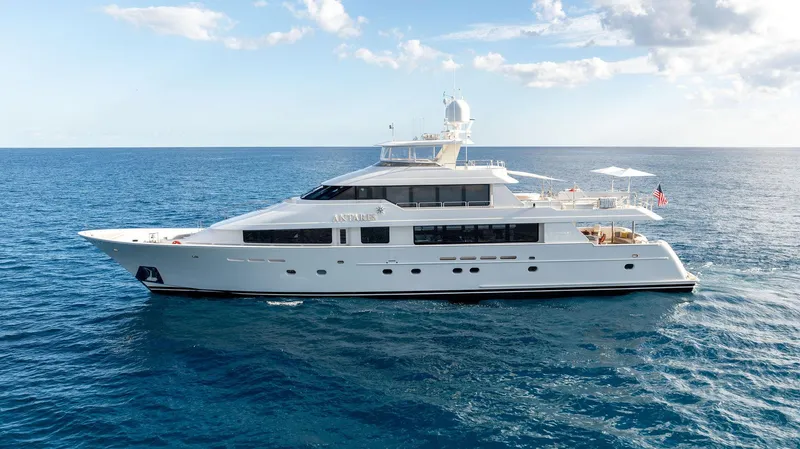 Slide: The Image of Westport 130 yacht, 2008 model, cruising on open sea under clear skies. - 19