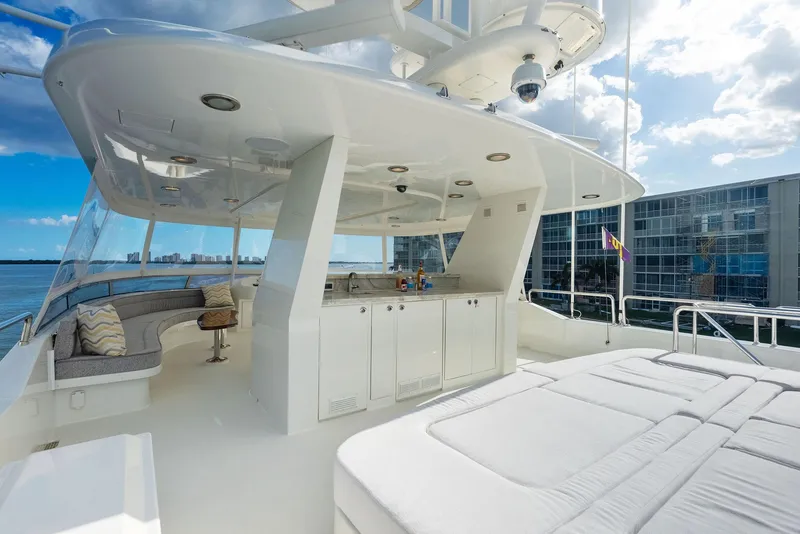 Slide: The Image of Luxurious 2008 Westport 130 yacht with spacious outdoor seating and sunbathing area. - 20