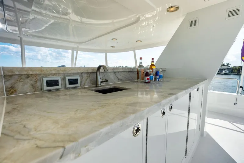 Slide: The Image of Luxurious marble countertop with sink on 2008 Westport 130 yacht, featuring scenic ocean view. - 24