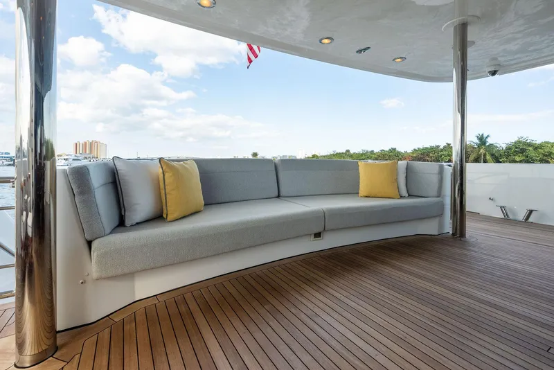 Slide: The Image of Luxurious outdoor seating on 2008 Westport 130 yacht with teak deck and scenic view. - 25