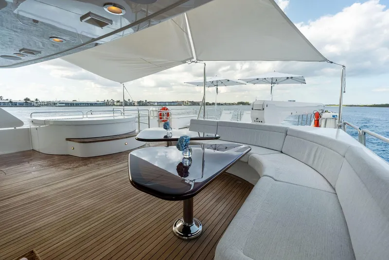 Slide: The Image of Luxurious deck of 2008 Westport 130 yacht with elegant seating and ocean view. - 27