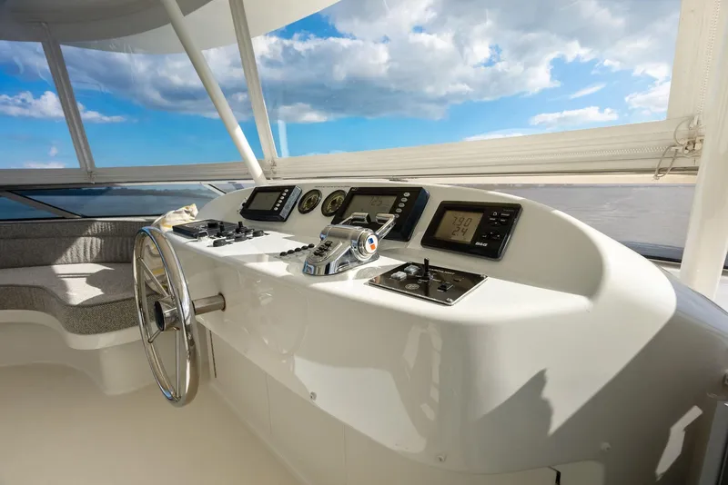 Slide: The Image of Helm station of 2008 Westport 130 yacht with navigation instruments and steering wheel. - 32