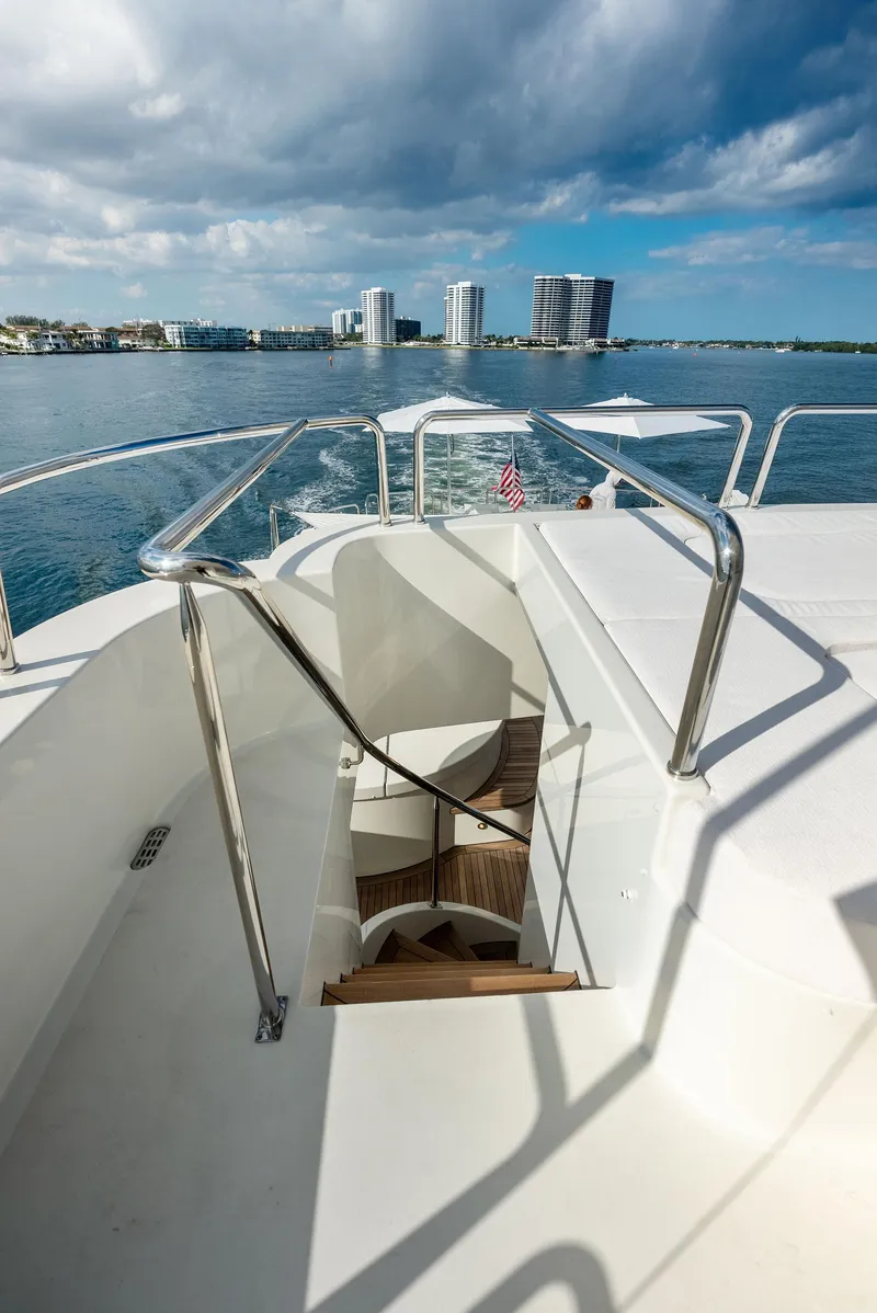 Slide: The Image of Staircase on 2008 Westport 130 yacht with ocean and cityscape background. - 33