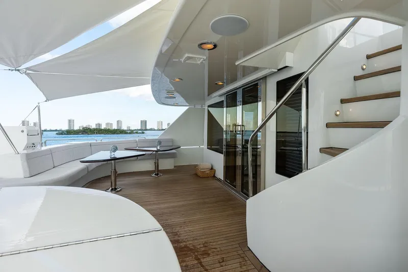 Slide: The Image of Luxurious deck of 2008 Westport 130 yacht with seating area and ocean view. - 37