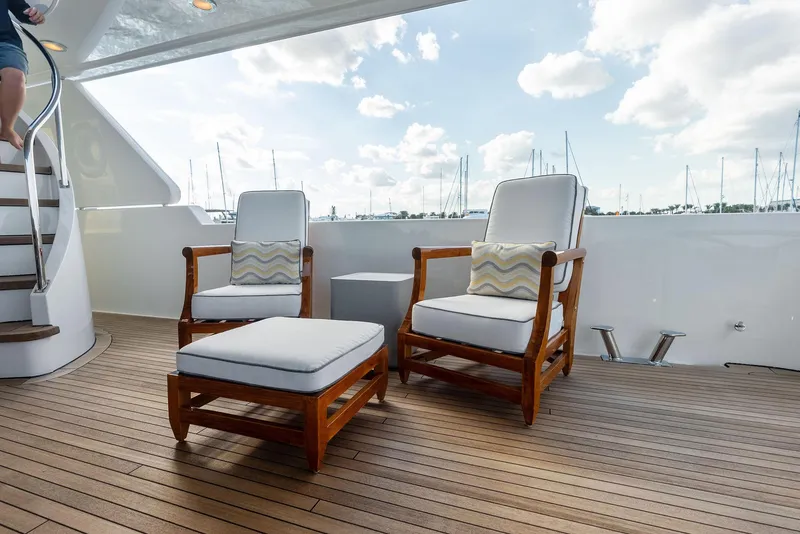 Slide: The Image of Luxury deck seating on 2008 Westport 130 yacht with marina view. - 38