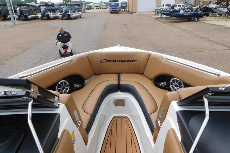 Slide: The Image of 2024 Crownline 220 SS LPX boat, side view with logo and trailer step. - 3