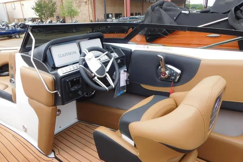 Slide: The Image of 2024 Crownline 220 SS LPX throttle control with start/stop button and trim controls. - 9