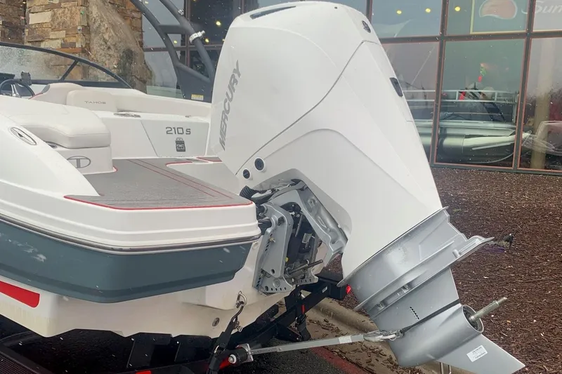 Slide: The Image of 2023 Tahoe 210S boat with Mercury outboard motor. - 2