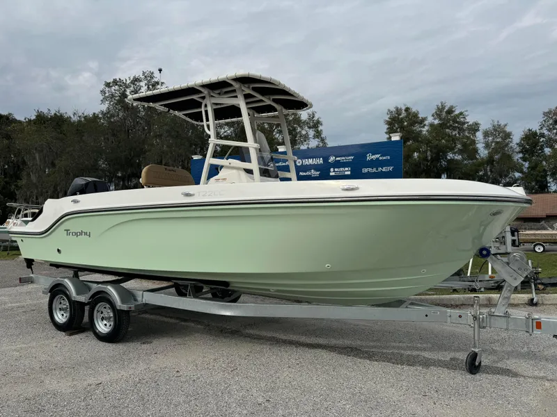 The Image of 2024 Bayliner Trophy CC22 boat on a trailer, side view. - 0