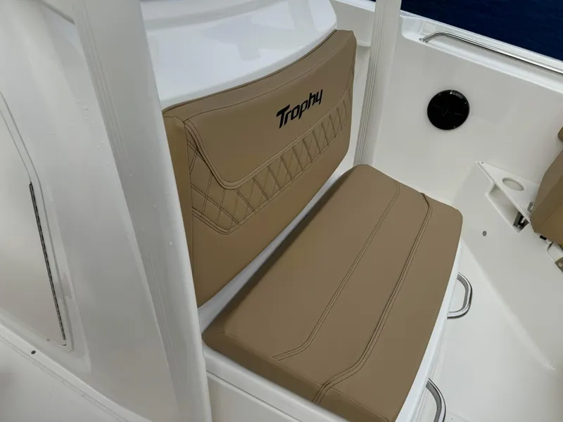 Slide: The Image of 2024 Bayliner Trophy CC22 boat seat with tan upholstery. - 5