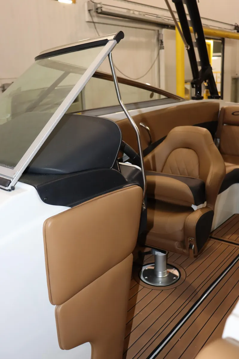 Slide: The Image of 2024 Crownline 240 SS SURF boat interior with tan leather seats and modern design. - 15