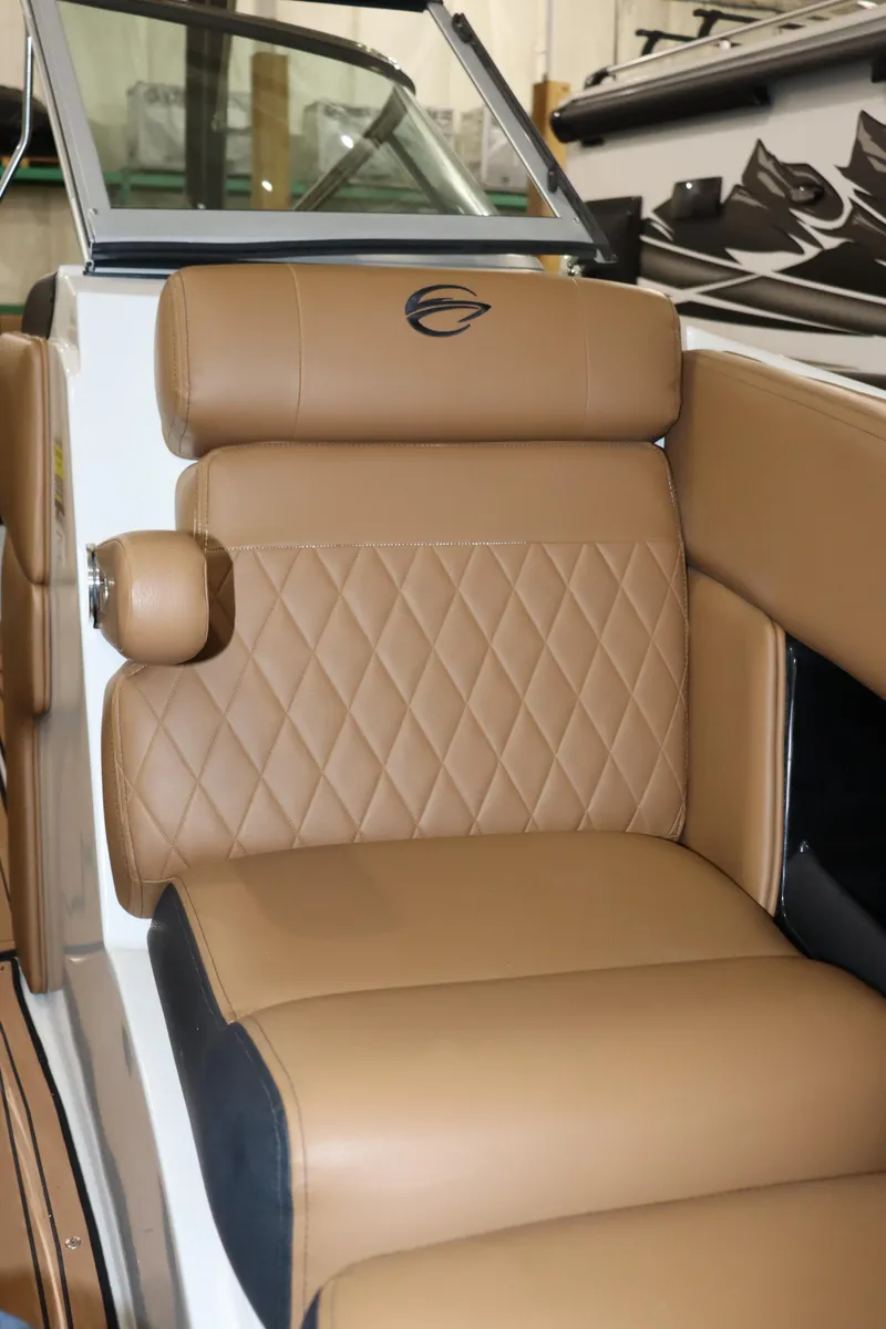 Slide: The Image of 2024 Crownline 240 SS SURF boat with luxurious tan leather seating. - 17