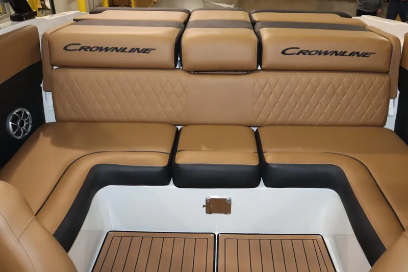 Slide: The Image of 2024 Crownline 240 SS SURF boat with luxurious tan seating. - 21