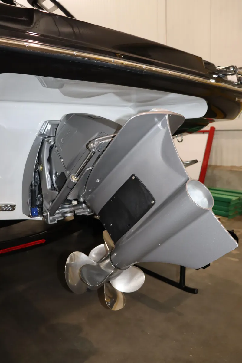 Slide: The Image of 2024 Crownline 240 SS SURF boat stern with propeller in a showroom. - 3