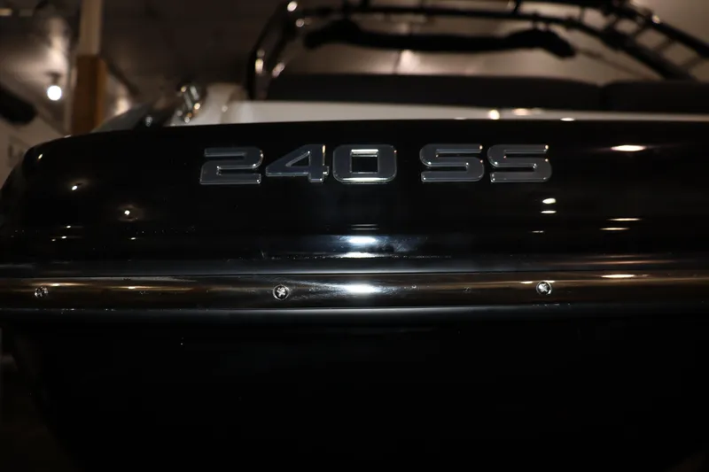Slide: The Image of Close-up of 2024 Crownline 240 SS SURF boat model nameplate. - 4