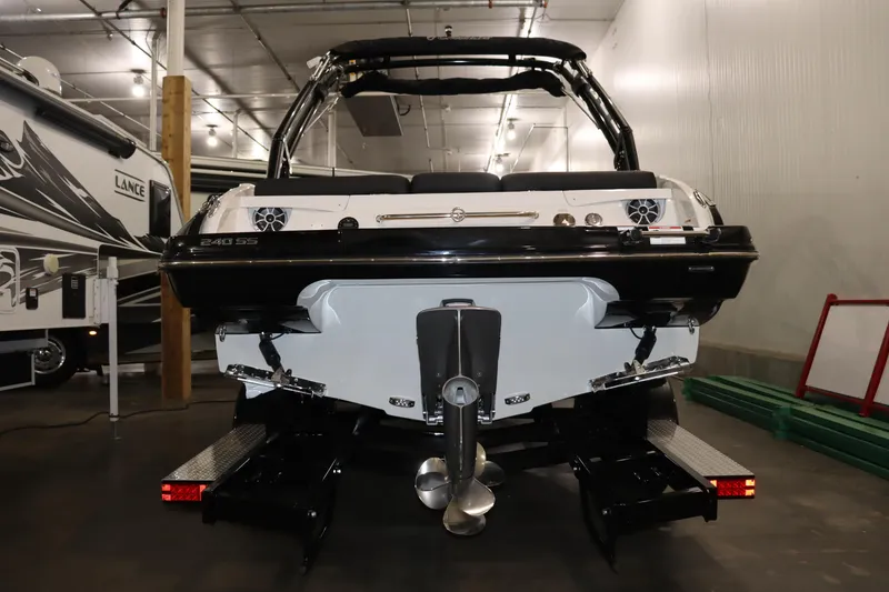 Slide: The Image of 2024 Crownline 240 SS SURF boat in indoor storage. - 5