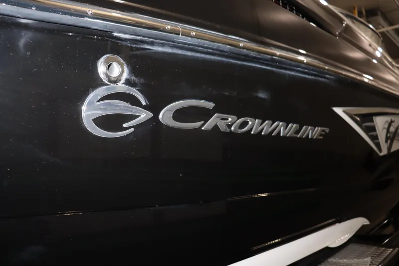 Slide: The Image of 2024 Crownline 240 SS SURF boat logo on black hull. - 6