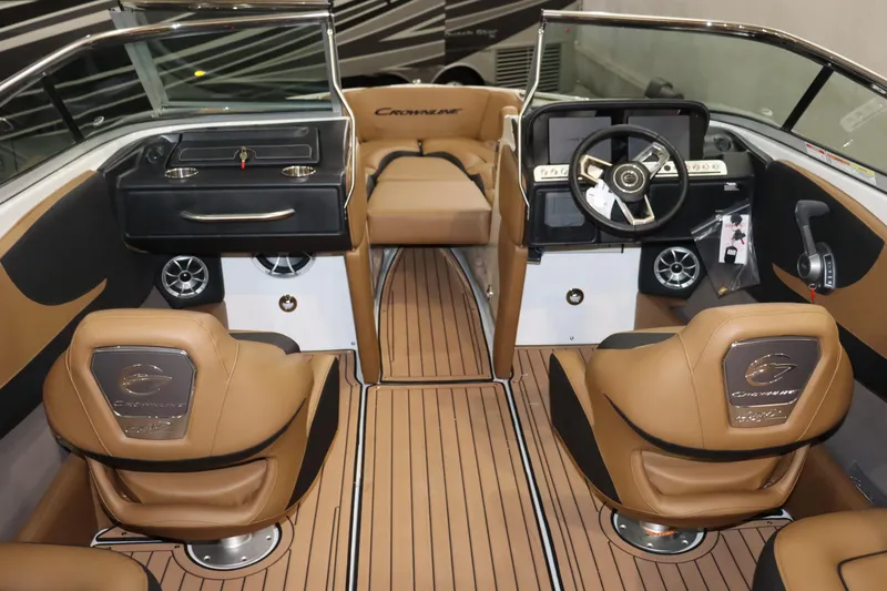 Slide: The Image of Interior of 2024 Crownline 240 SS SURF boat with tan leather seats and modern dashboard. - 7