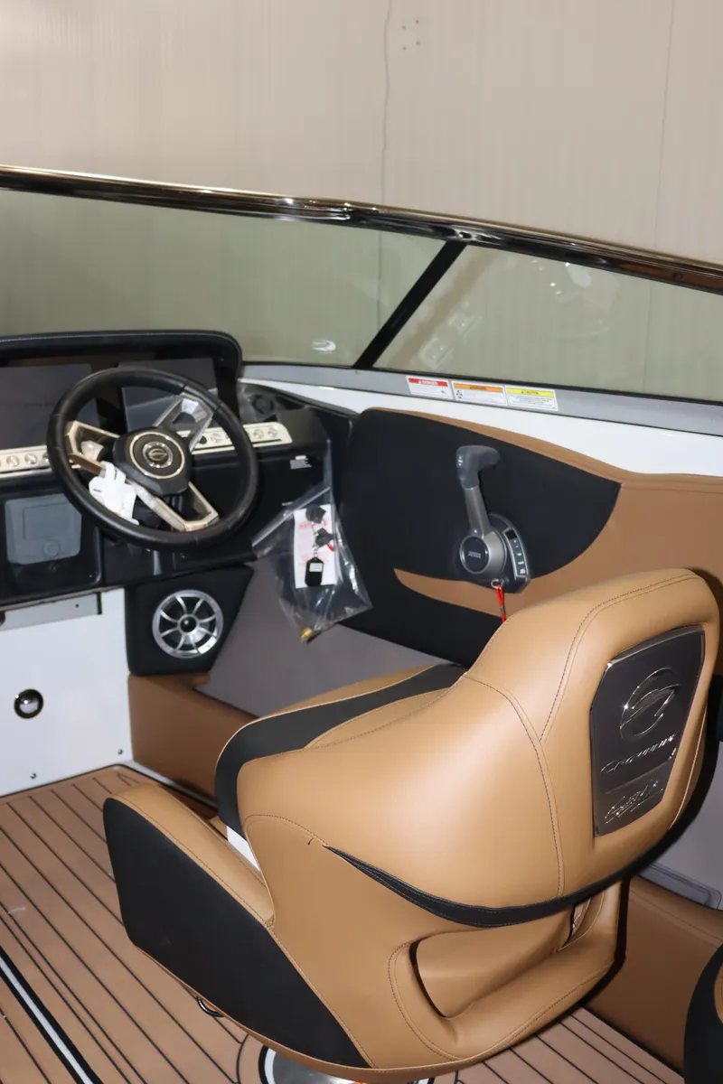 Slide: The Image of 2024 Crownline 240 SS SURF boat interior with tan and black seating. - 8