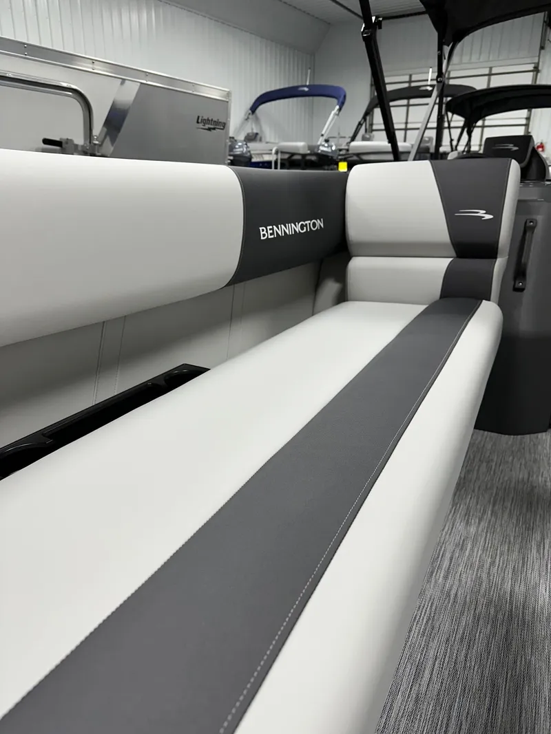 Slide: The Image of 2025 Bennington 22 SSB Tritoon interior seating with sleek design and premium upholstery. - 15