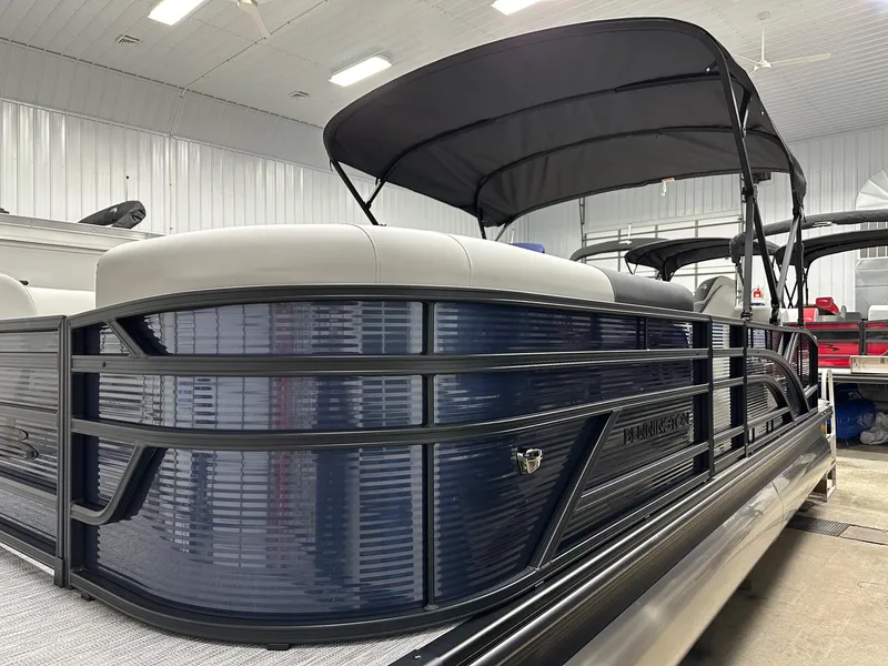 Slide: The Image of 2025 Bennington 22 SSB Swing Back Tritoon with Yamaha F-150Hp in showroom. - 19