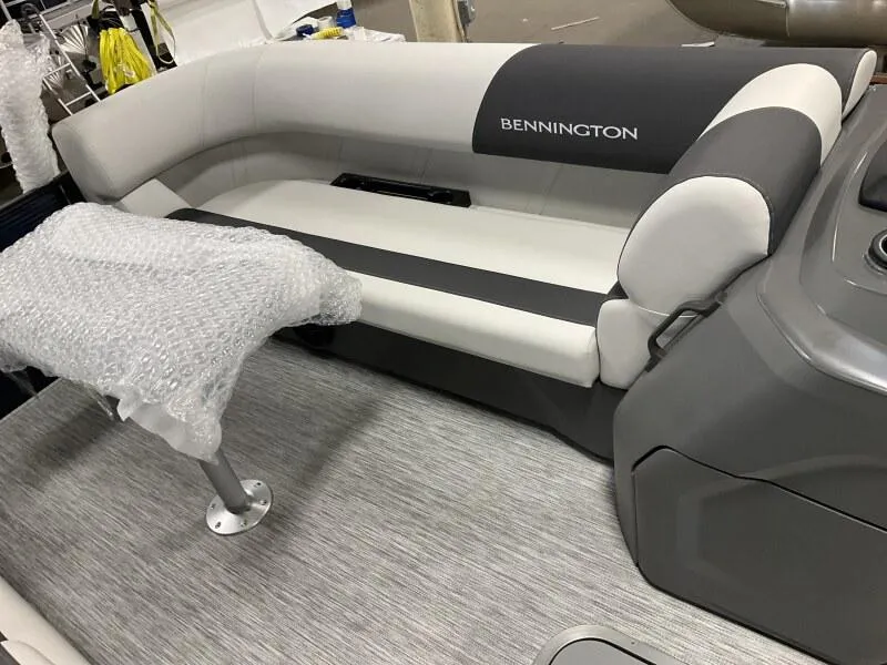 Slide: The Image of 2025 Bennington 22 SSB Tritoon interior with cushioned seating and table, featuring Yamaha F-150Hp. - 27