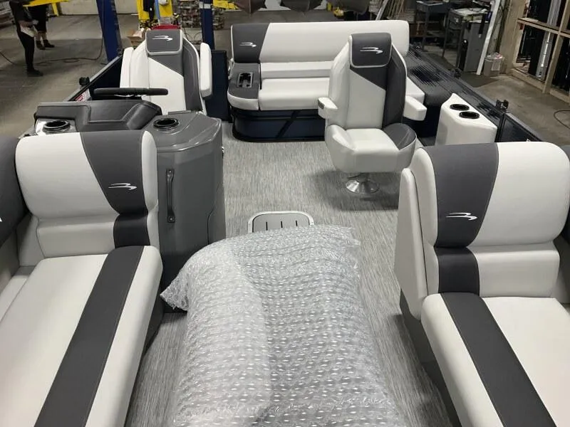 Slide: The Image of 2025 Bennington 22 SSB Tritoon interior with plush seating and modern design. - 29