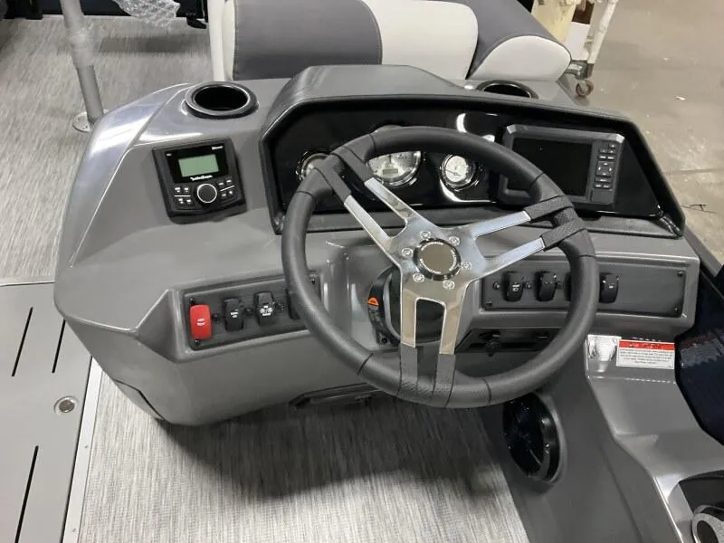 Slide: The Image of 2025 Bennington 22 SSB Tritoon helm with steering wheel and control panel. - 3
