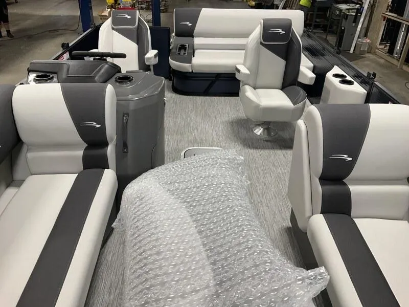 Slide: The Image of 2025 Bennington 22 SSB Tritoon interior with Yamaha F-150Hp, featuring plush seating and modern design. - 30