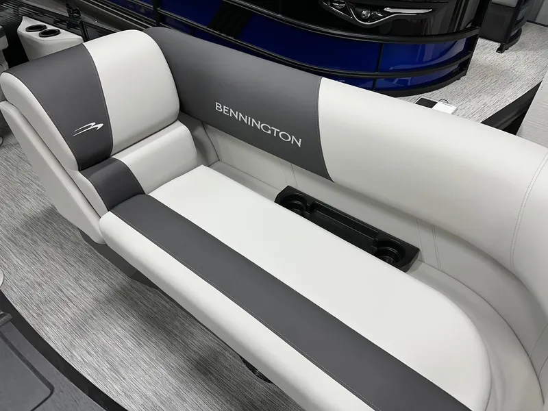 Slide: The Image of 2025 Bennington 22 SSB Tritoon interior seating with stylish gray and white upholstery. - 33