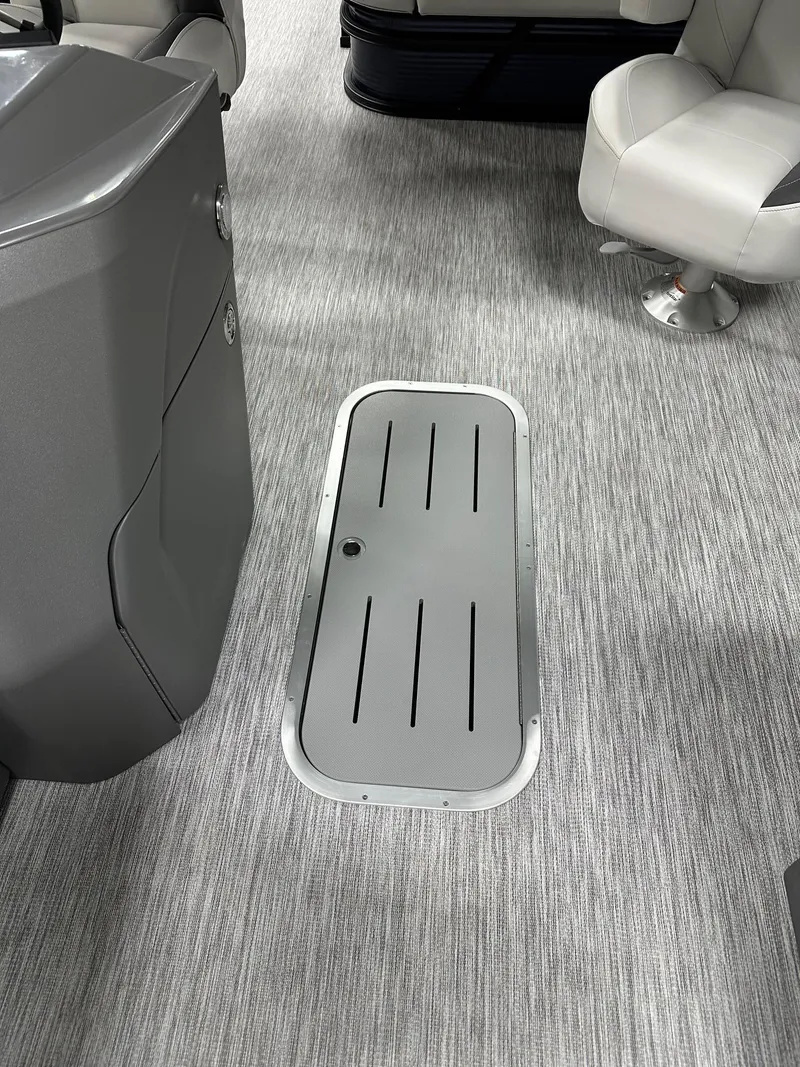 Slide: The Image of Interior of 2025 Bennington 22 SSB Tritoon, featuring sleek flooring and seating. - 34
