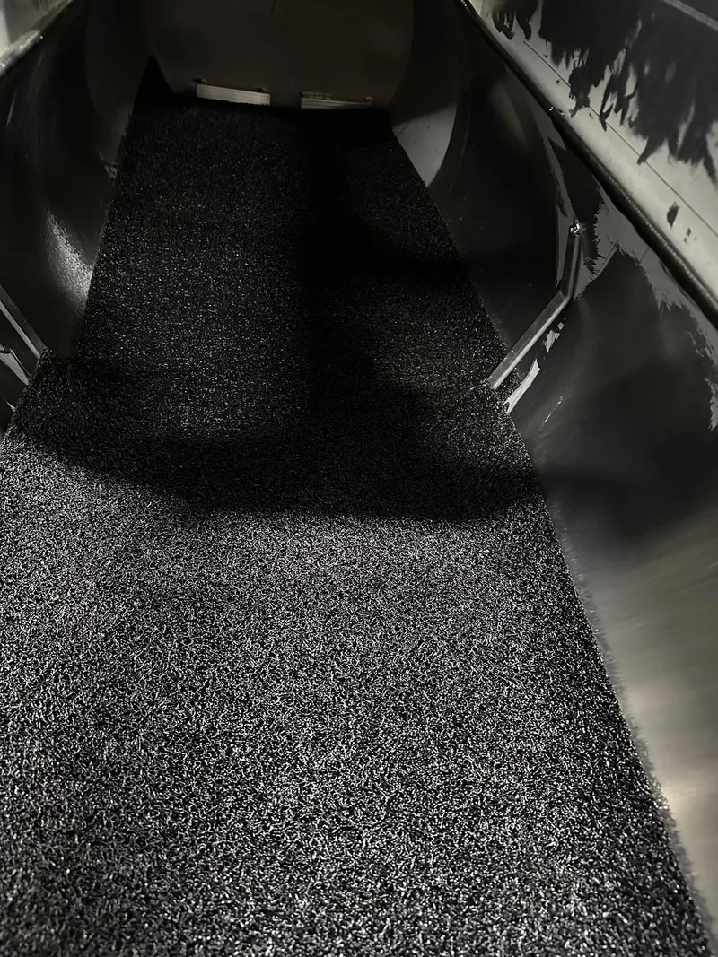 Slide: The Image of Interior view of 2025 Bennington 22 SSB Tritoon with textured flooring. - 35