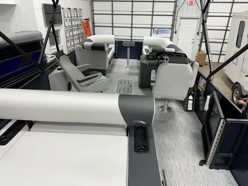 Slide: The Image of 2025 Bennington 22 SSB Tritoon interior with Yamaha F-150Hp, showcasing seating and helm. - 39