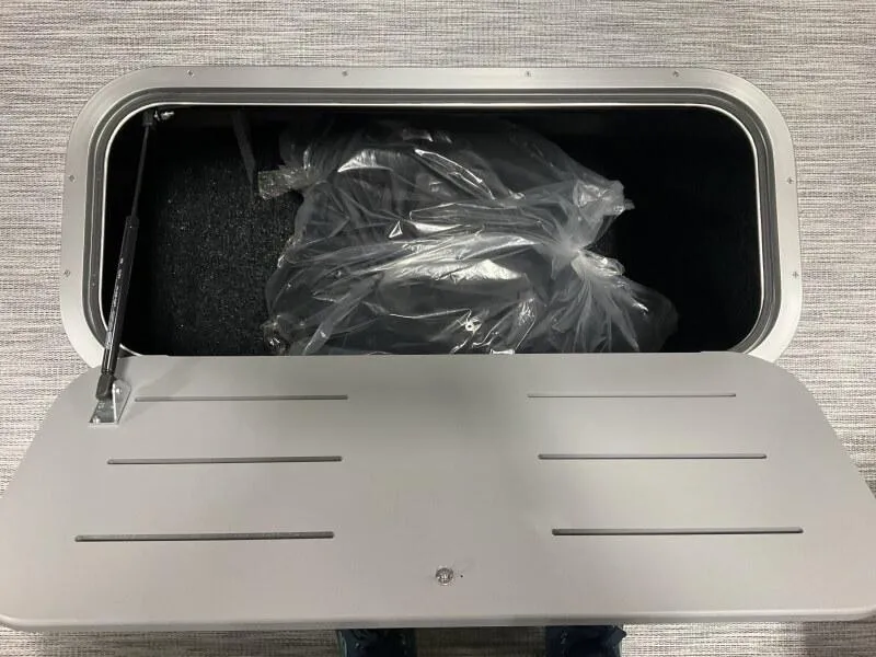 Slide: The Image of Storage compartment of 2025 Bennington 22 SSB Tritoon, featuring a Yamaha F-150Hp engine. - 4