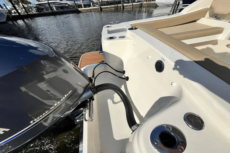 Slide: The Image of 2021 Scout 215 Dorado boat with Yamaha four-stroke engine at marina. - 28