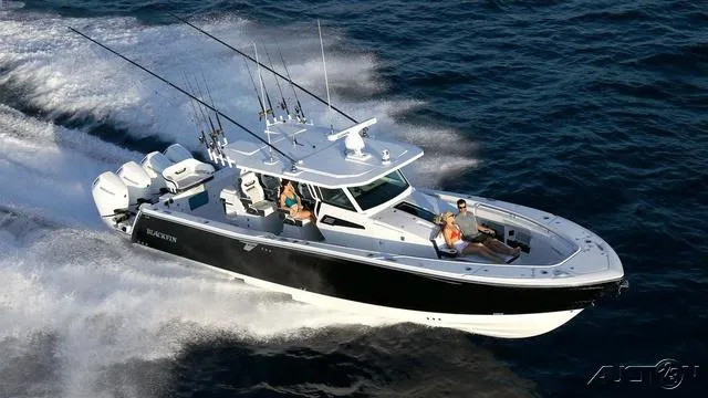 The Image of 2024 Blackfin 400CC boat cruising on the ocean with passengers. - 1